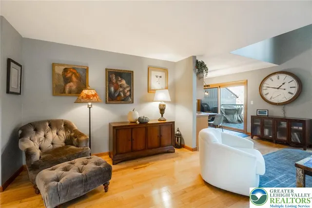 a kitchen with a table chairs and a refrigerator
