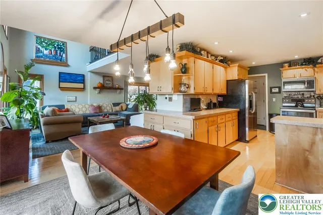 a kitchen with a sink a stove a refrigerator and cabinets