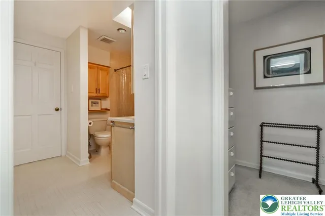 a bedroom with a bed and a lamp on table