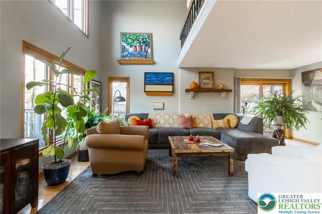 a vase of flowers sitting in front of a window