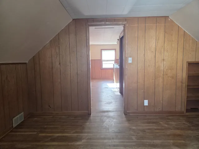 a view of entryway with wooden floor