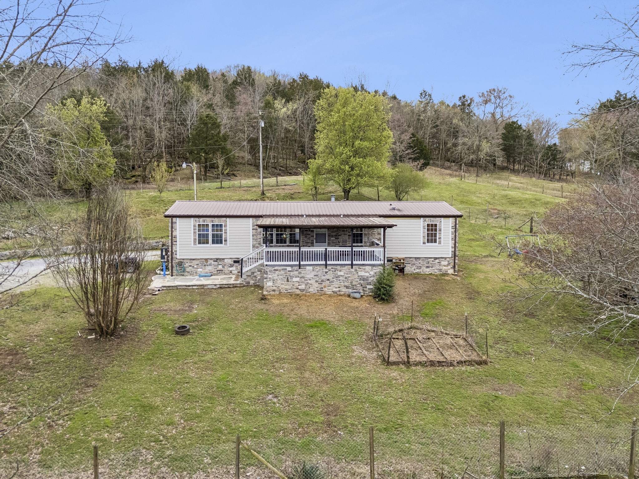 47 Riddleton Circle Riddleton, TN 37151 - Photo 2 of 46 a view of a house with a yard