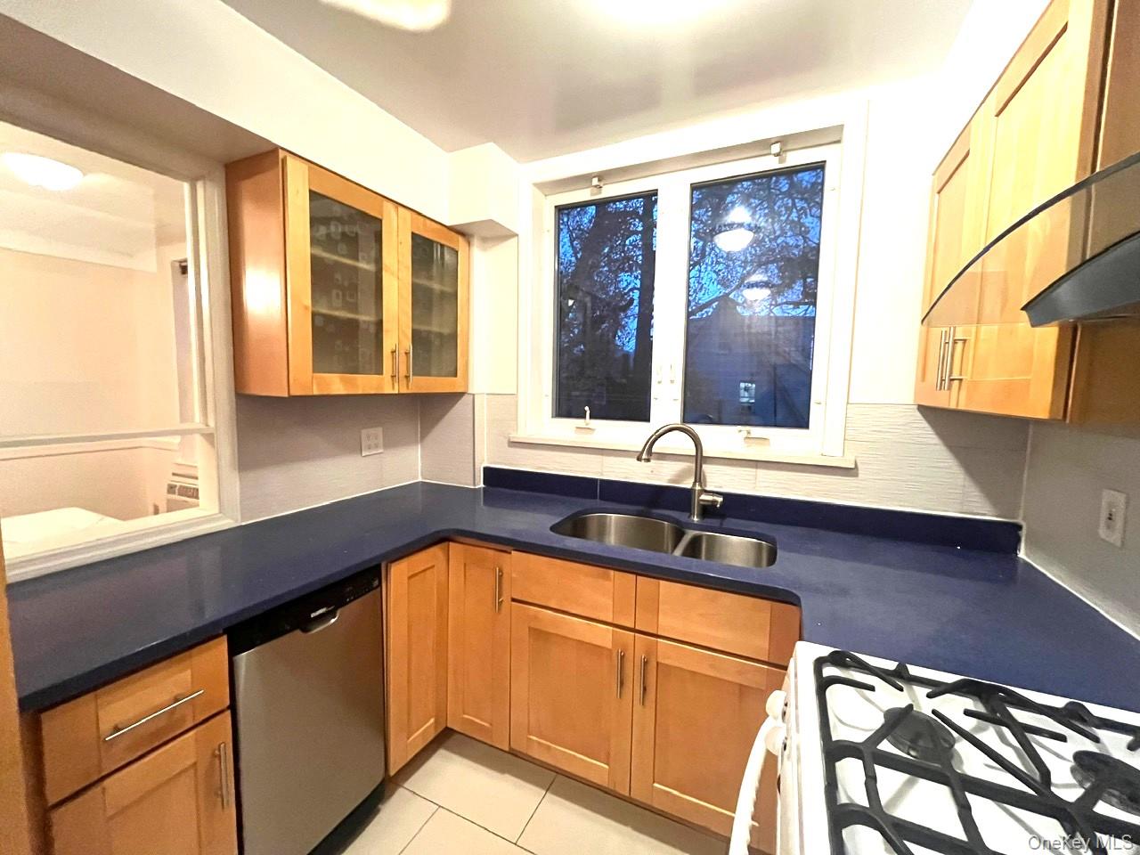 1945 Paulding Avenue Bronx, NY 10462 - Photo 11 of 12 a kitchen with stainless steel appliances granite countertop a sink and a microwave