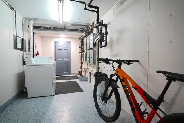 a view of a storage & utility room with washer and dryer