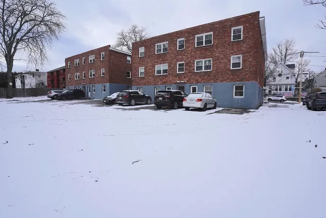 a view of a building with a yard