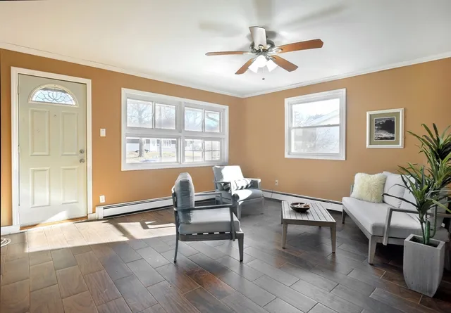 a living room with furniture and a window