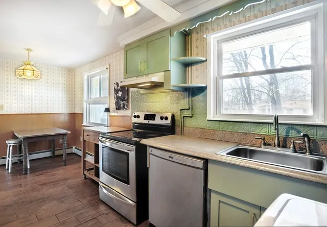 a kitchen that has a sink and a stove