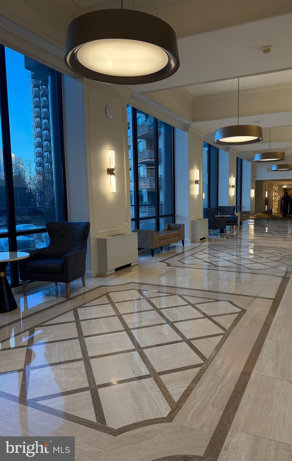 5225 Pooks Hill, Unit 710N Bethesda, MD 20814 - Photo 11 of 64 a lobby with furniture and a chandelier