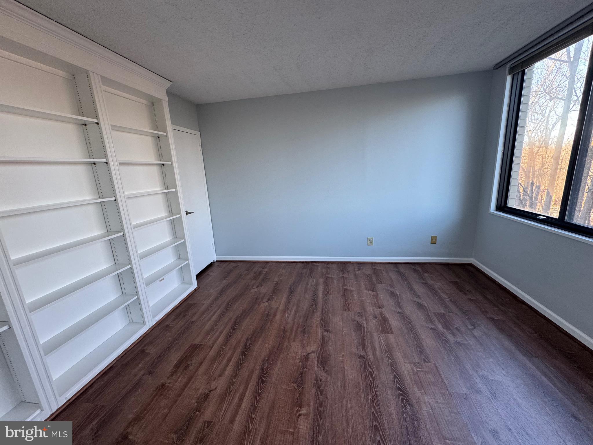 5225 Pooks Hill, Unit 710N Bethesda, MD 20814 - Photo 45 of 64 a view of a room with wooden floors and window