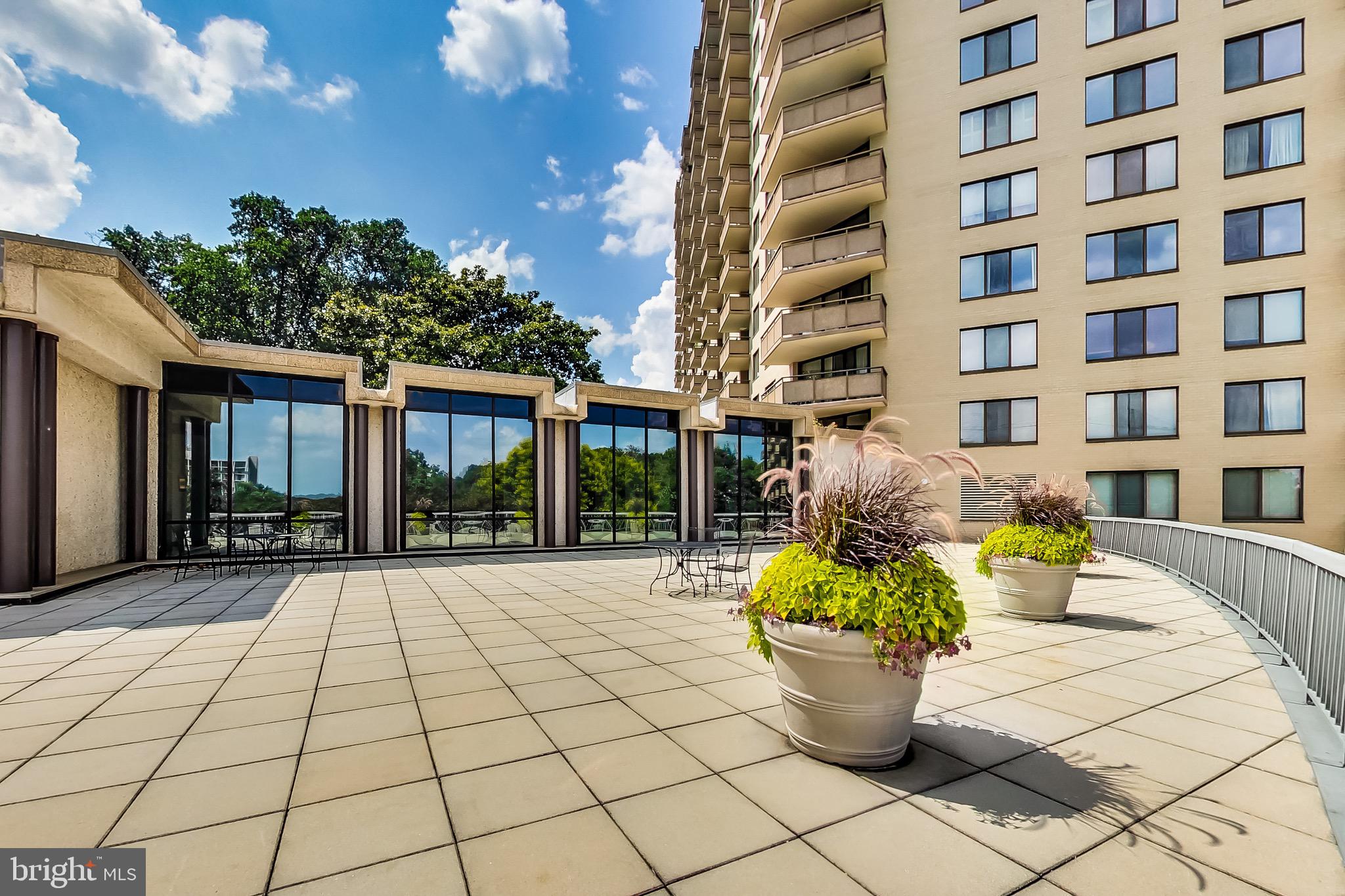 5225 Pooks Hill, Unit 710N Bethesda, MD 20814 - Photo 48 of 64 a view of a white building next to a yard
