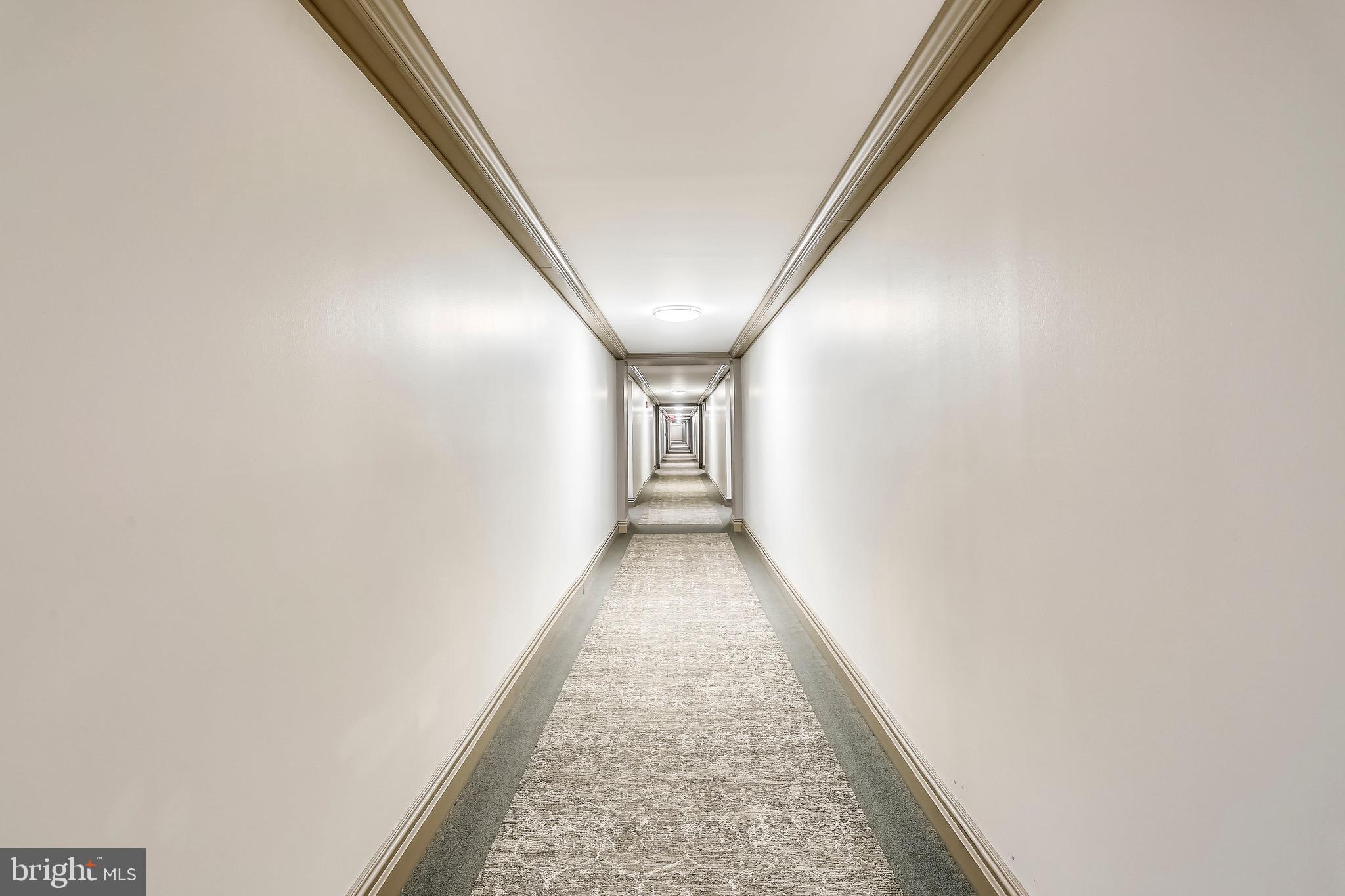 5225 Pooks Hill, Unit 710N Bethesda, MD 20814 - Photo 49 of 64 a view of a hallway with a white walls