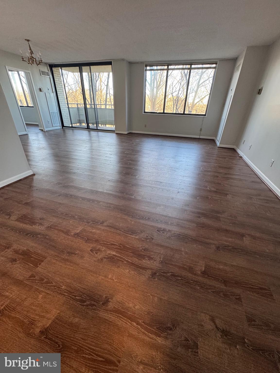 5225 Pooks Hill, Unit 710N Bethesda, MD 20814 - Photo 50 of 64 an empty room with wooden floor and windows