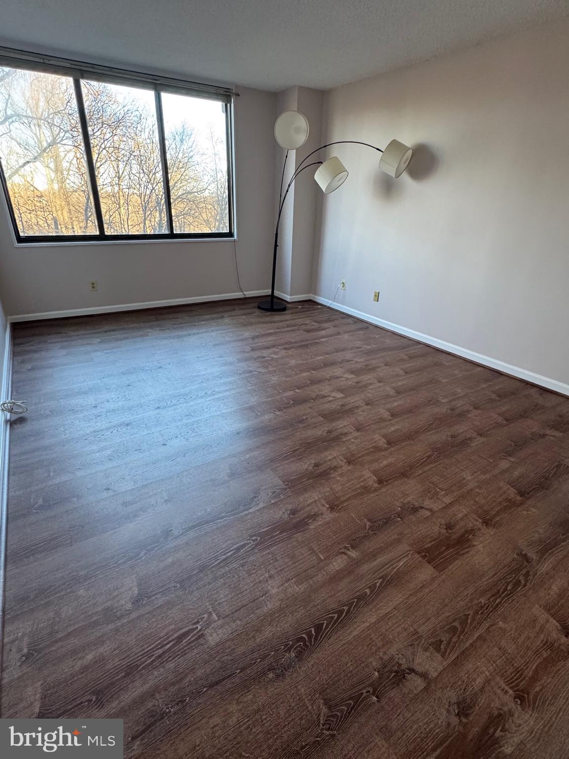 5225 Pooks Hill, Unit 710N Bethesda, MD 20814 - Photo 51 of 64 an empty room with wooden floor and windows
