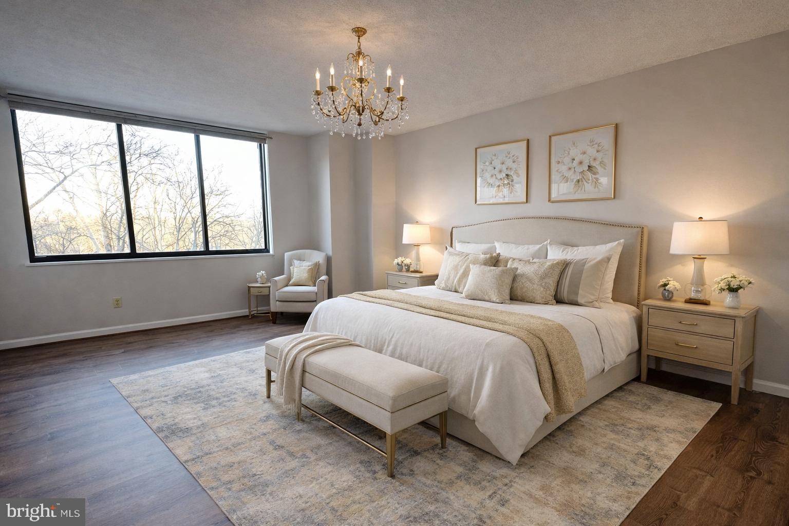 5225 Pooks Hill, Unit 710N Bethesda, MD 20814 - Photo 52 of 64 a spacious bedroom with a bed and a chandelier
