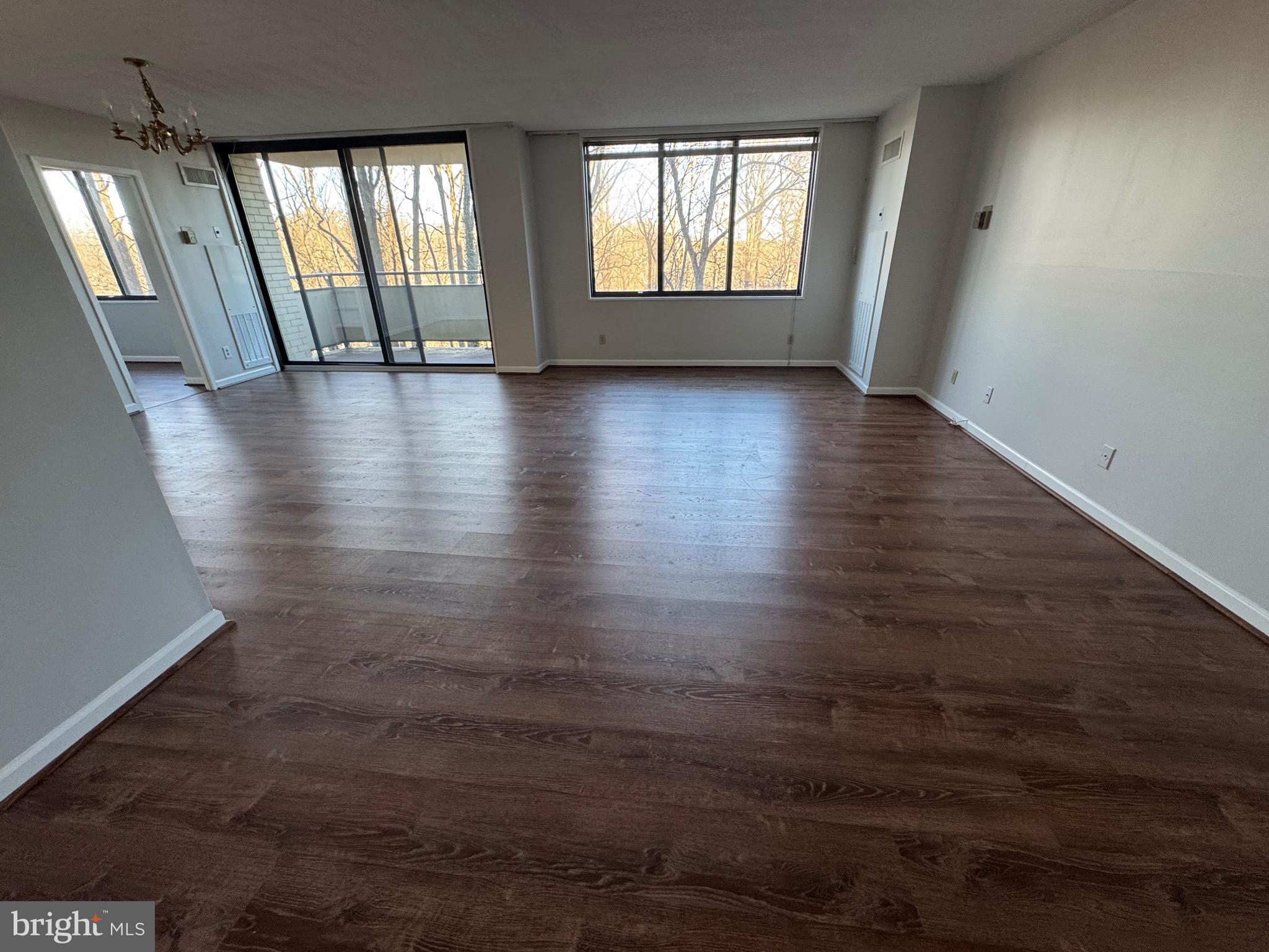 5225 Pooks Hill, Unit 710N Bethesda, MD 20814 - Photo 57 of 64 an empty room with wooden floor and windows