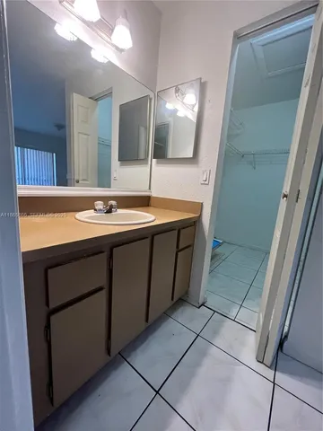 a white toilet sitting next to a shower