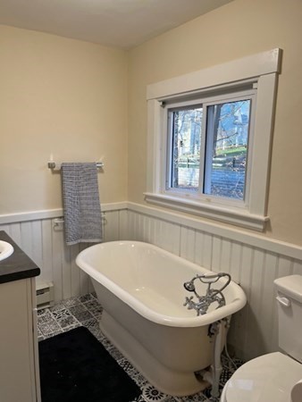 36 Cambridge Street Ayer, MA 01432 - Photo 15 of 28 a bathroom with a sink and a bathtub
