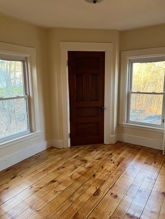 36 Cambridge Street Ayer, MA 01432 - Photo 21 of 28 a view of an empty room with a window