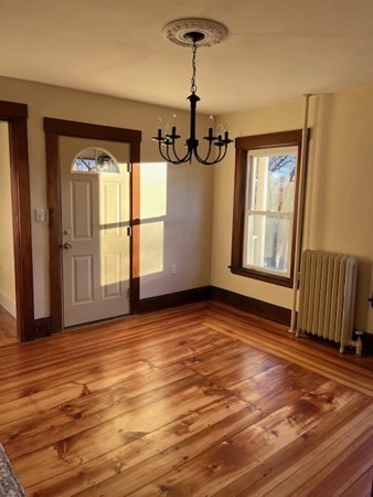36 Cambridge Street Ayer, MA 01432 - Photo 3 of 28 a view of empty room with wooden floor and fan