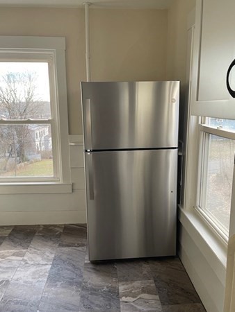 36 Cambridge Street Ayer, MA 01432 - Photo 8 of 28 a refrigerator freezer sitting in a kitchen
