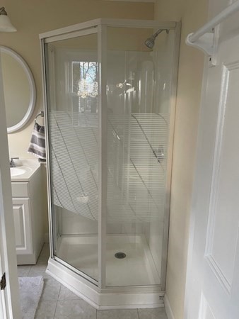 36 Cambridge Street Ayer, MA 01432 - Photo 9 of 28 a bathroom with a shower a toilet and sink