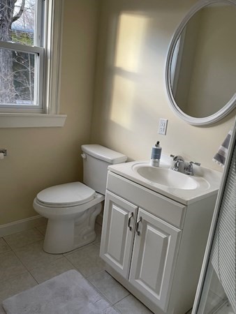 36 Cambridge Street Ayer, MA 01432 - Photo 10 of 28 a bathroom with a sink toilet and mirror