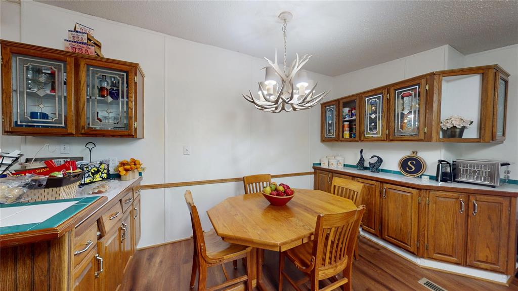 670 Arbin Culpepper Road Jonesboro, LA 71251 - Photo 6 of 17 a view of a dining room and livingroom with furniture wooden floor a chandelier