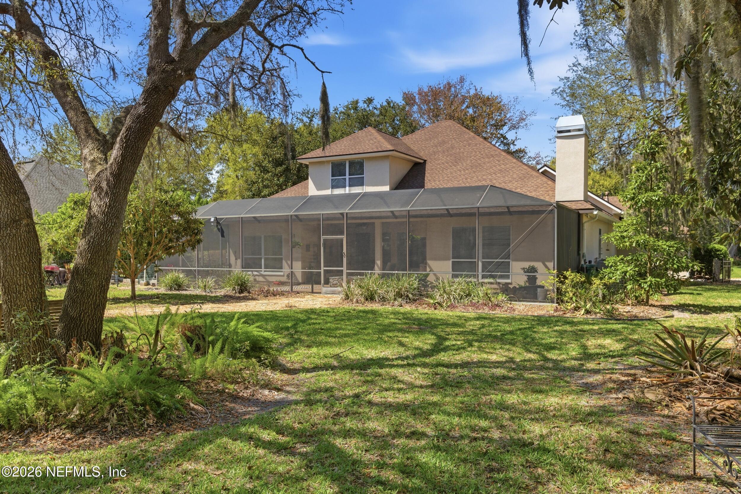 14779 Amelia View Drive Jacksonville, FL 32226 - Photo 46 of 81 Backyard and Screened Patio
