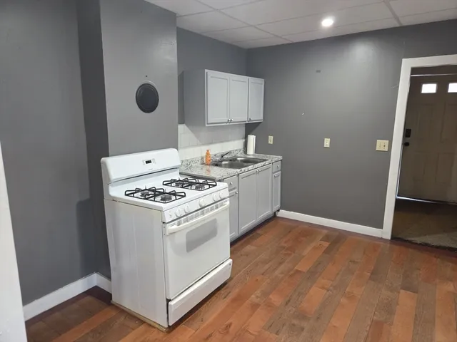 a kitchen with a stove and a refrigerator