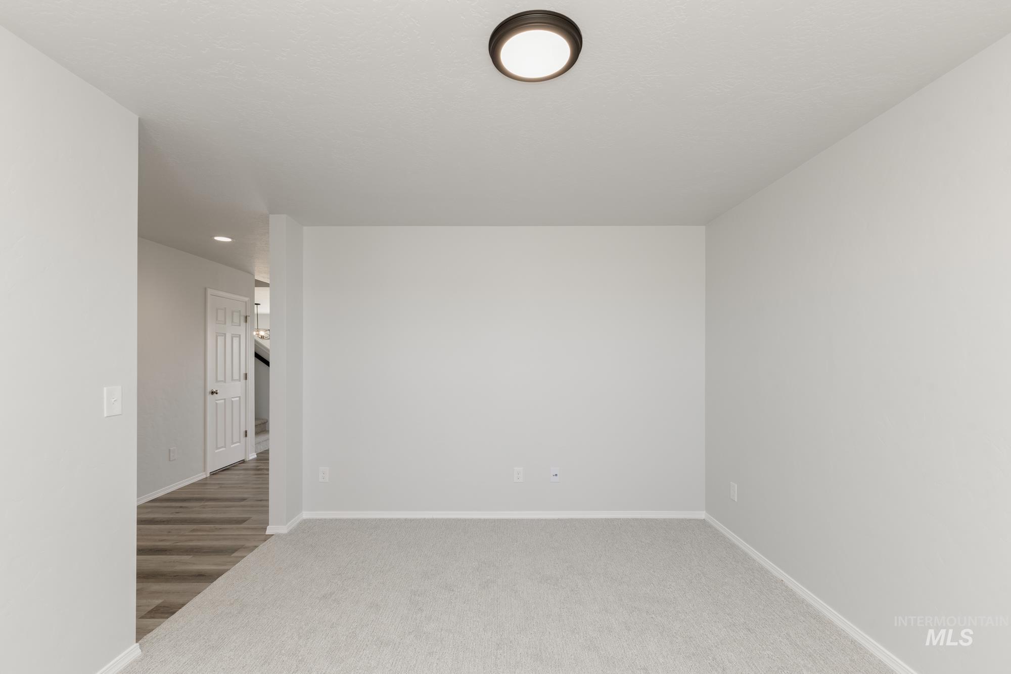 13681 Inman Court Caldwell, ID 83607 - Photo 14 of 31 Spare room with baseboards and light colored carpet