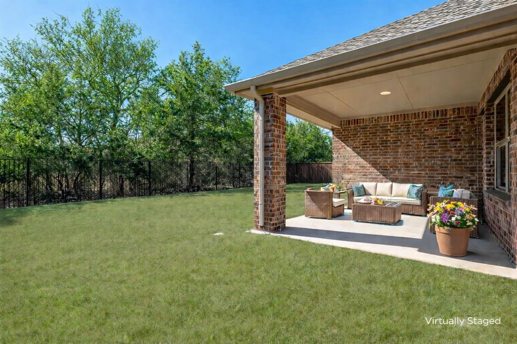1500 Elizabeth Street Anna, TX 75409 - Photo 16 of 25 a view of a patio with table and chairs potted plants with wooden floor and fence