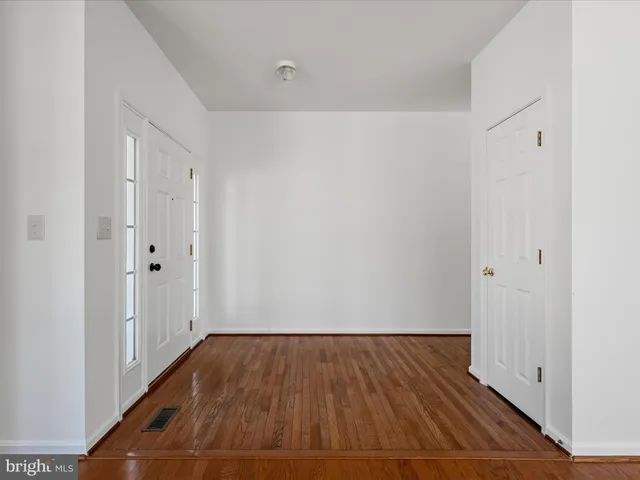 a bathroom with a sink a toilet a mirror and vanity