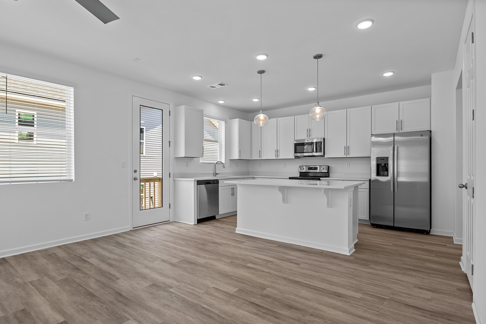 138 Timber Crest Trail White Bluff, TN 37187 - Photo 4 of 21 a kitchen with a refrigerator and white cabinets
