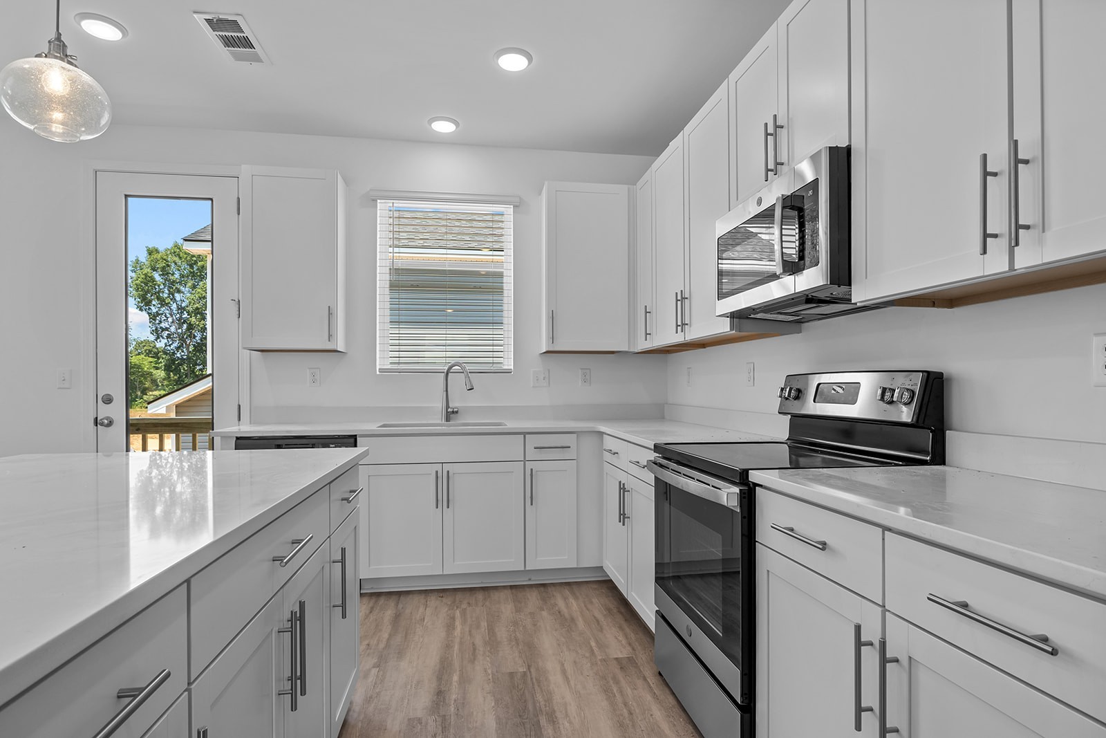 138 Timber Crest Trail White Bluff, TN 37187 - Photo 6 of 21 a kitchen with stainless steel appliances granite countertop white cabinets granite counter tops and a window