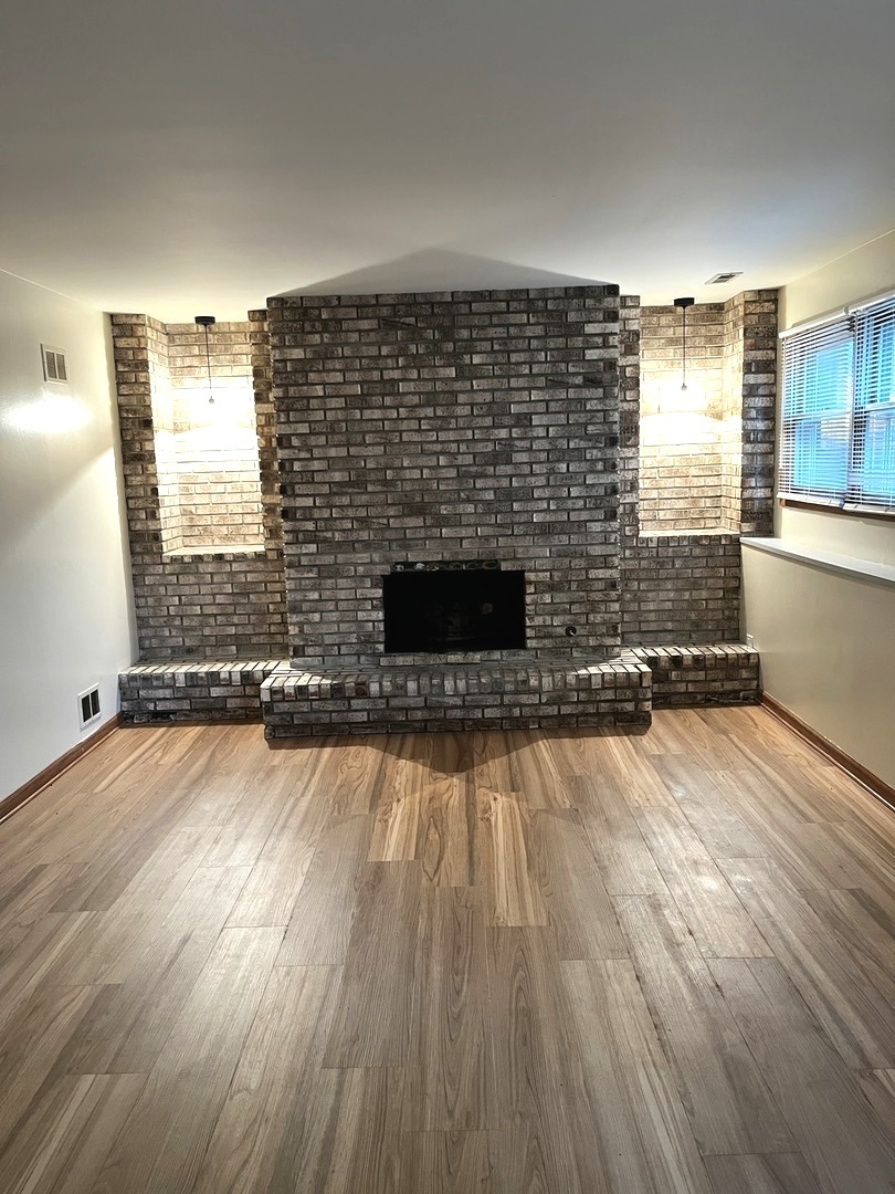 18430 Aberdeen Street Homewood, IL 60430 - Photo 12 of 13 a view of empty room with wooden floor and fan
