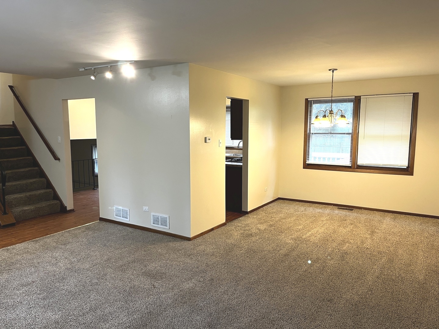 18430 Aberdeen Street Homewood, IL 60430 - Photo 2 of 13 an empty room with windows and fireplace