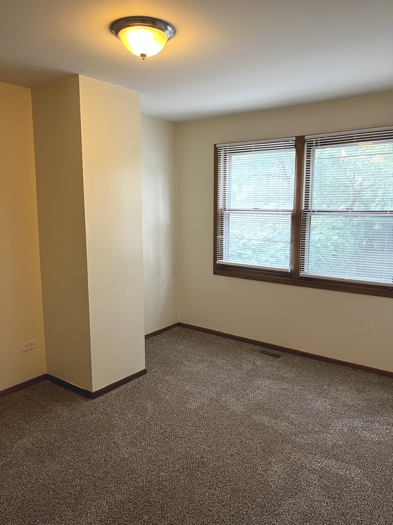 18430 Aberdeen Street Homewood, IL 60430 - Photo 8 of 13 an empty room with a window
