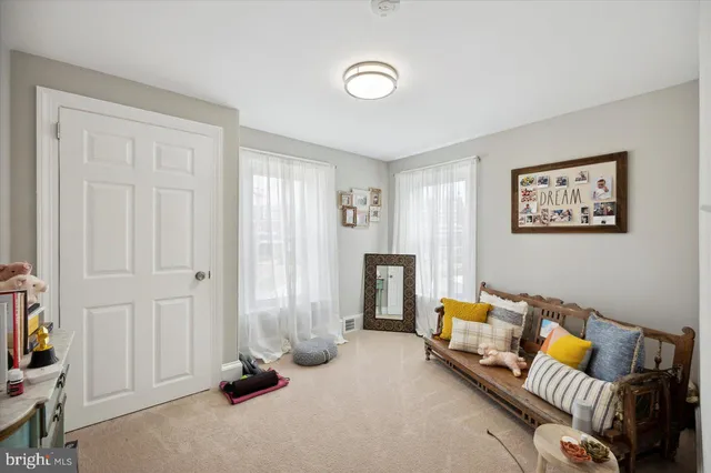 a bedroom with furniture and a window