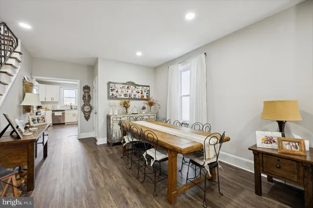 a view of a room with furniture and wooden floor