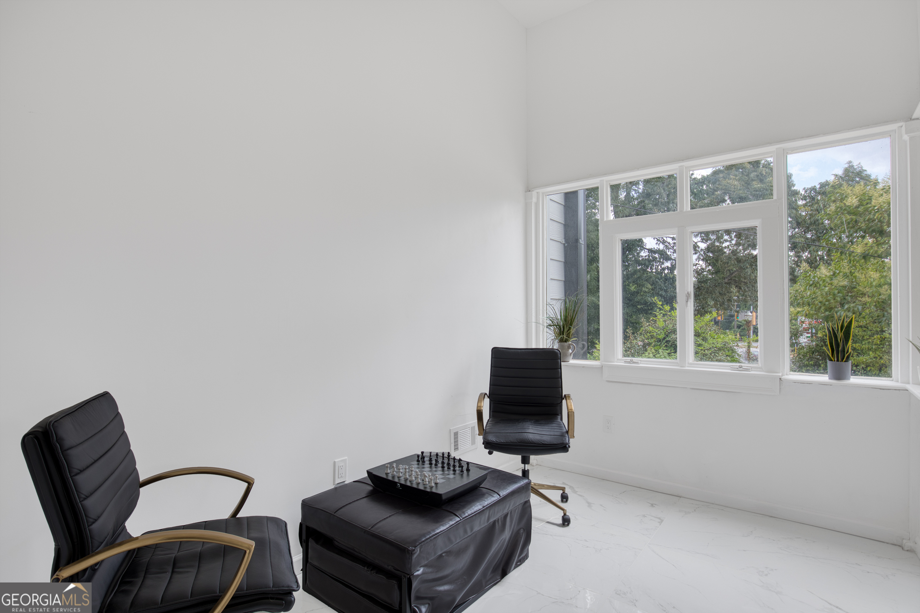 235 Candler Road Southeast Atlanta, GA 30317 - Photo 11 of 26 a living room with furniture a flat screen tv and a window