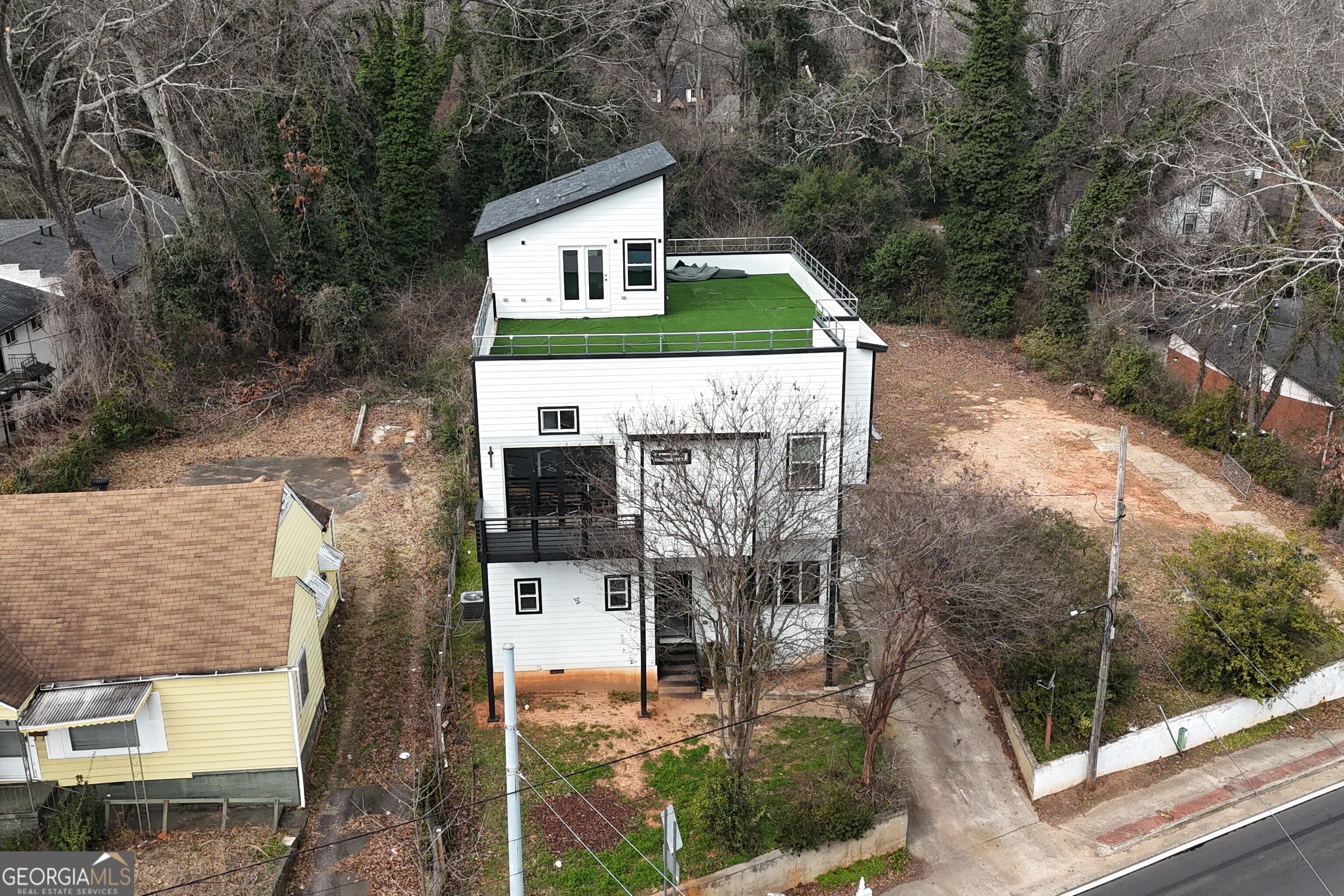 235 Candler Road Southeast Atlanta, GA 30317 - Photo 2 of 26 a front view of a house with a yard