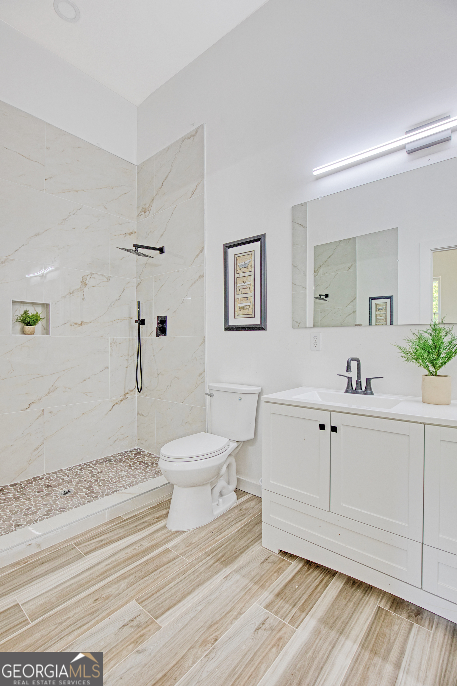 235 Candler Road Southeast Atlanta, GA 30317 - Photo 24 of 26 a bathroom with a sink mirror and toilet