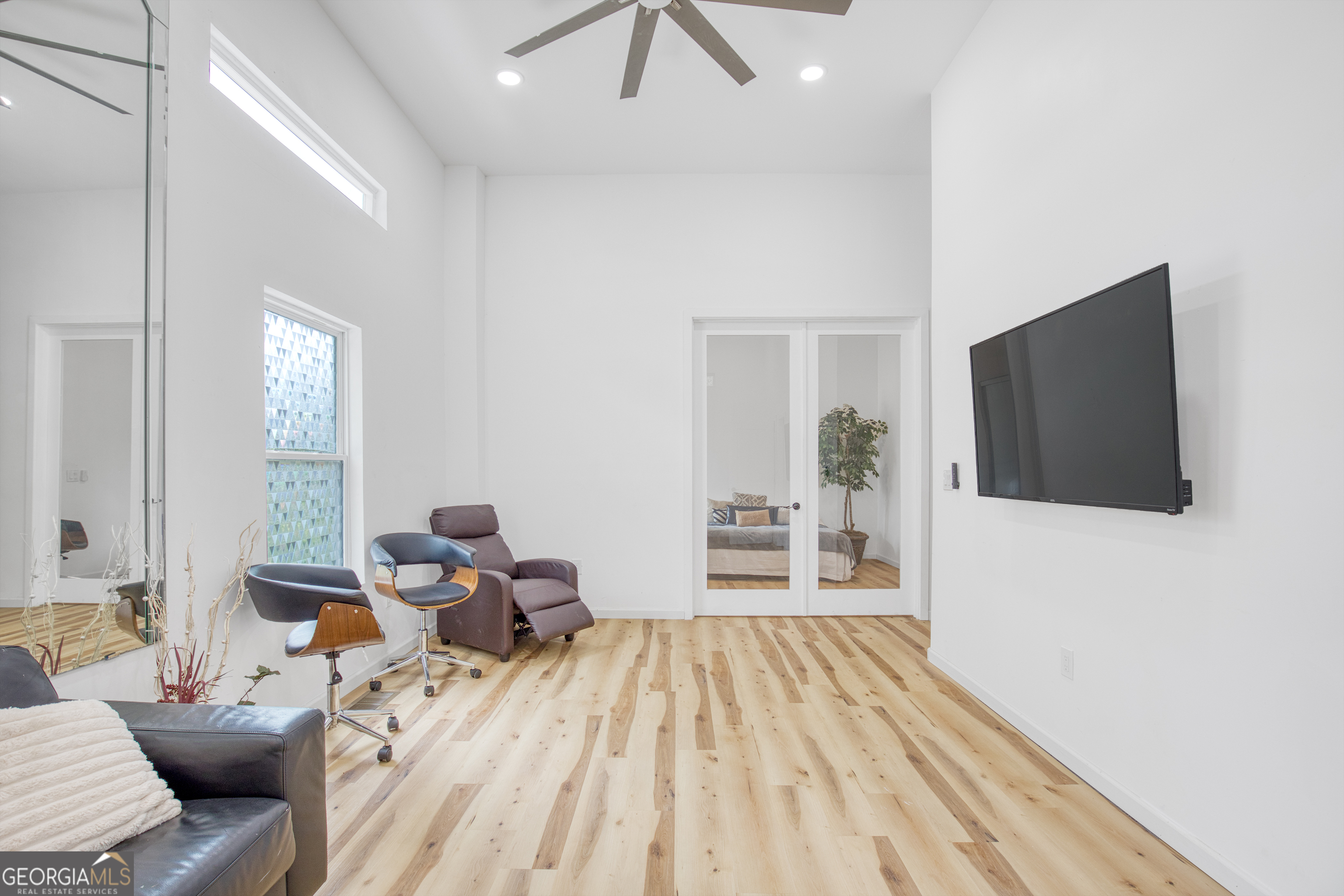 235 Candler Road Southeast Atlanta, GA 30317 - Photo 25 of 26 a living room with furniture and a flat screen tv