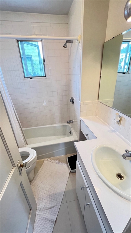 17 Winthrop Street Winthrop, MA 02152 - Photo 16 of 33 a bathroom with a sink and mirror with bathtub