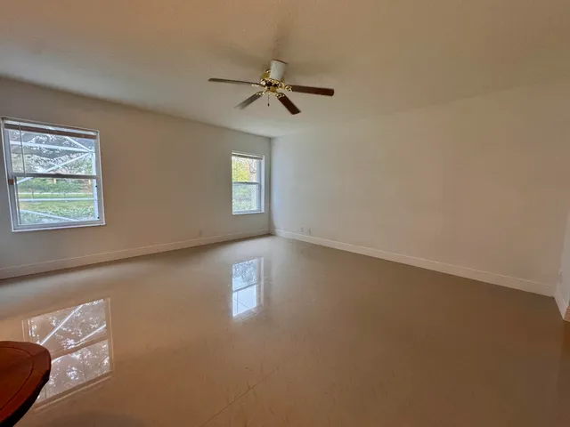 a view of empty room with windows