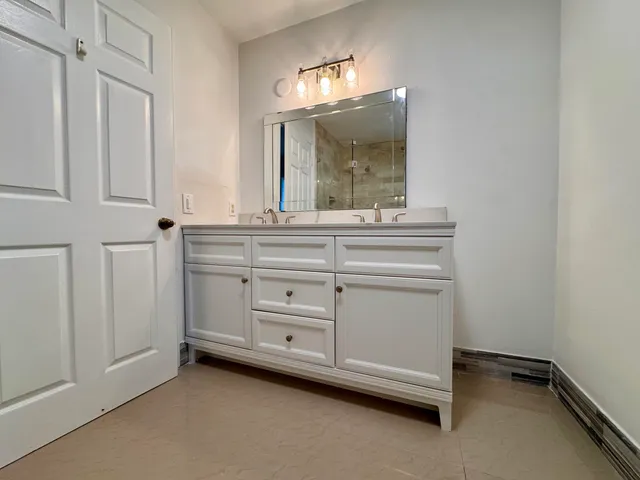 a bathroom with a shower and a toilet