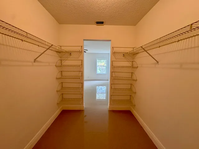 a view of a room with racks on the wall