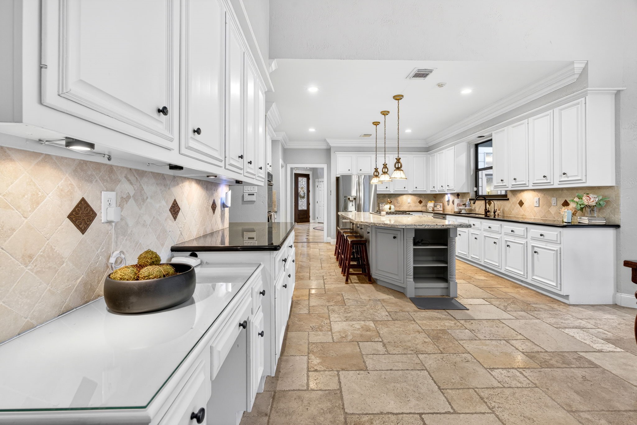 20006 Gable Point Drive Katy, TX 77450 - Photo 11 of 44 a kitchen with stainless steel appliances a stove sink and cabinets