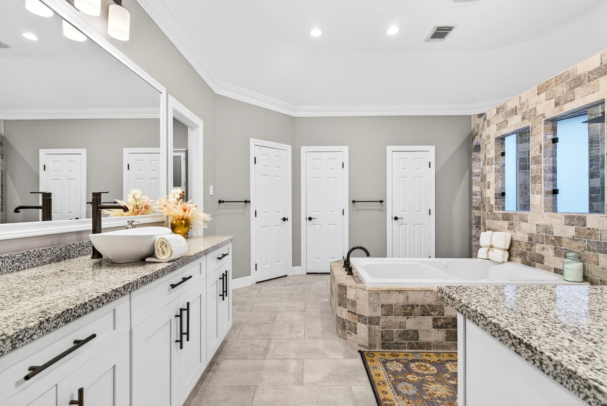 20006 Gable Point Drive Katy, TX 77450 - Photo 19 of 44 a spacious bathroom with a granite countertop sink and a mirror