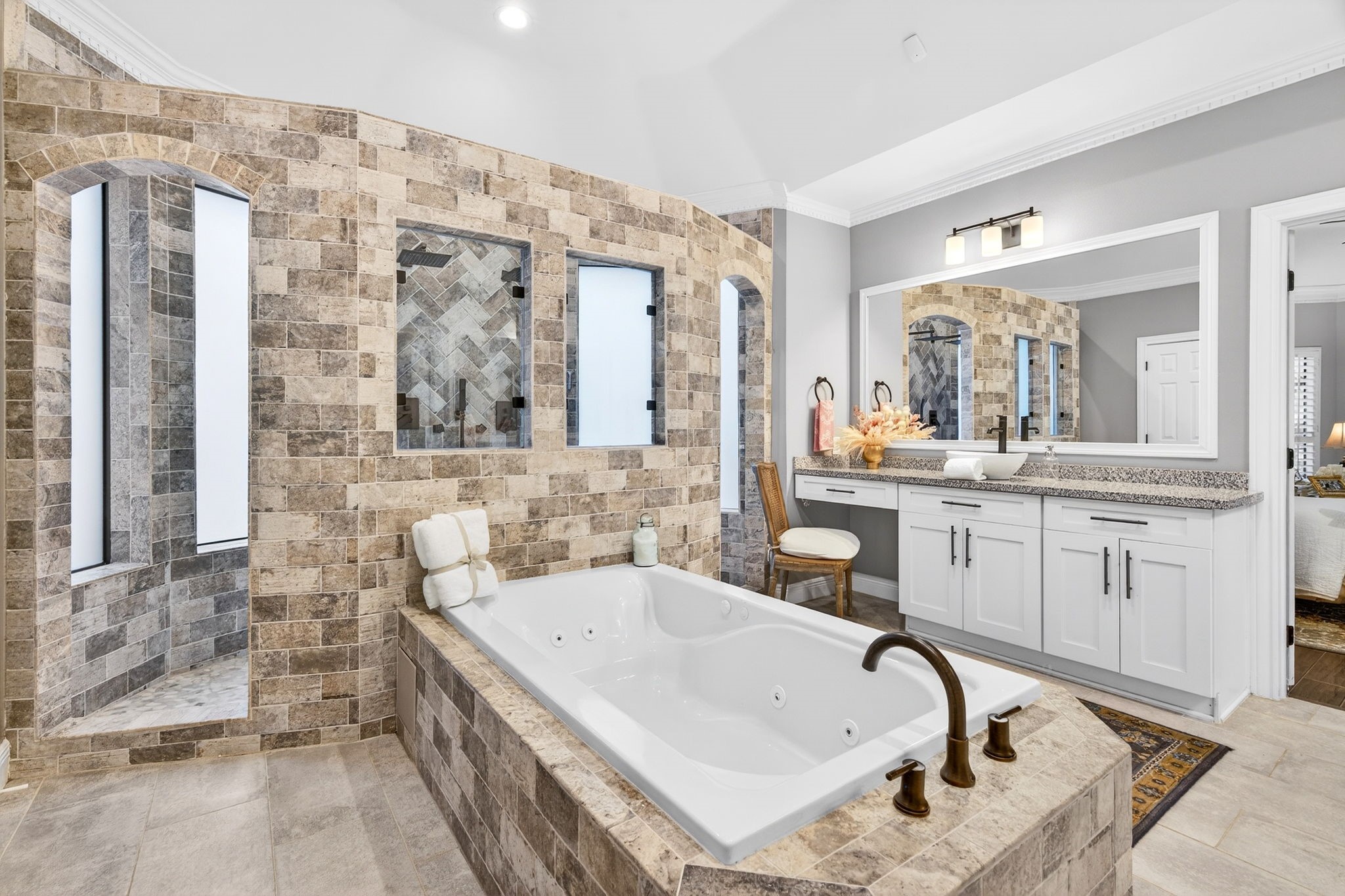 20006 Gable Point Drive Katy, TX 77450 - Photo 20 of 44 a bathroom with a tub sink and mirror